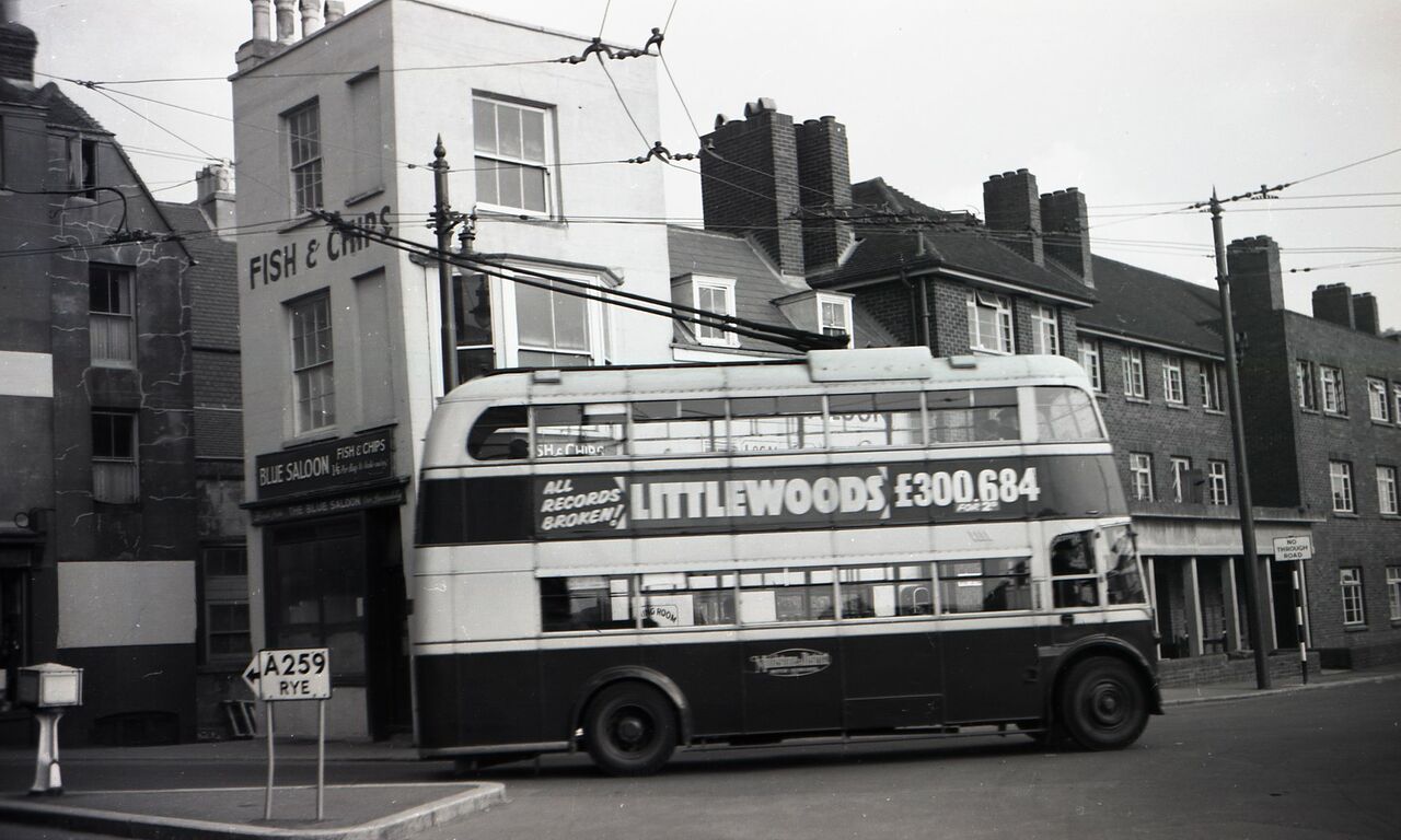File:Trolleybus passing Hastings Wall flats 1959.jpg